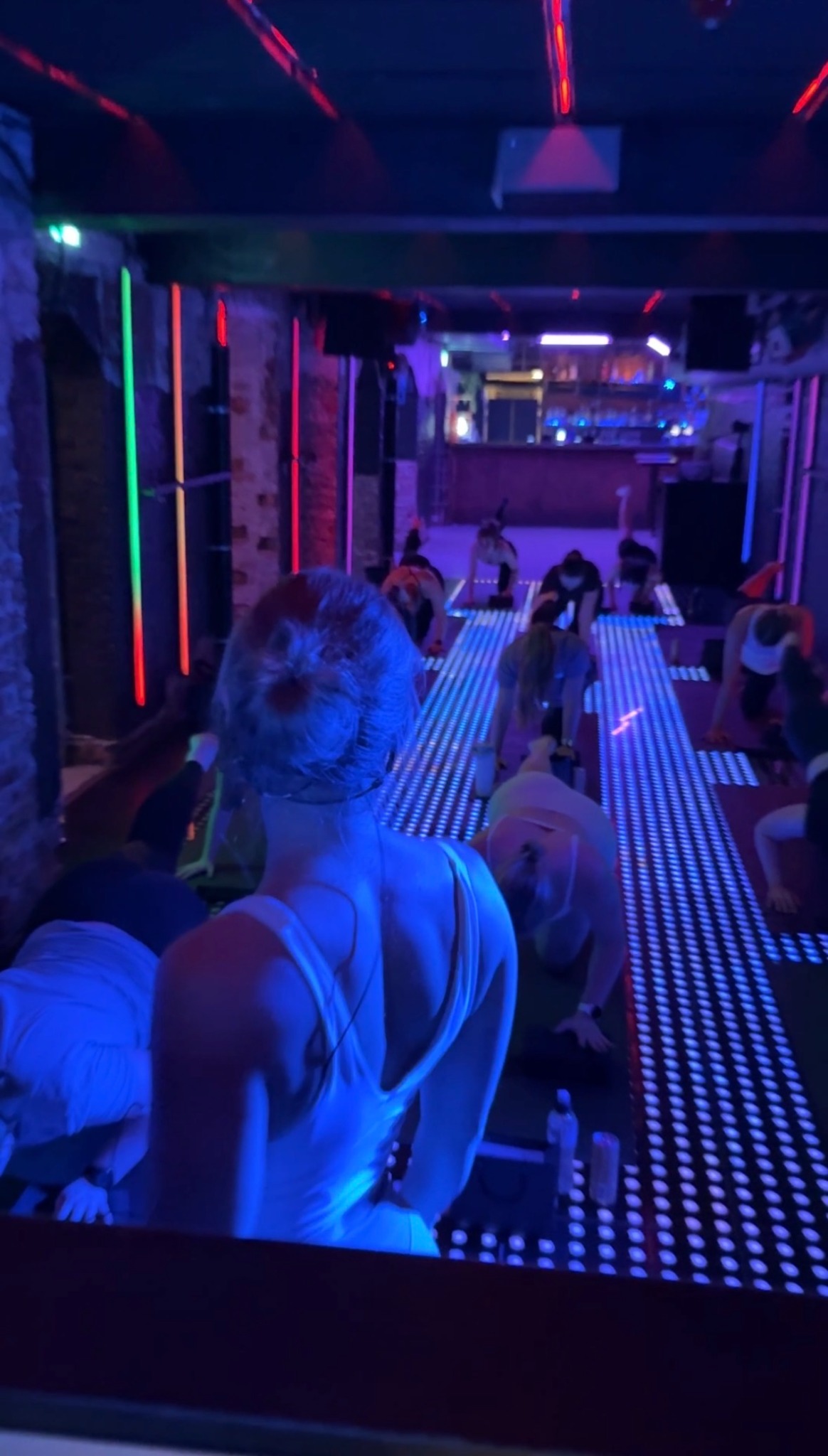 FORME Club class moving under red and blue club lights